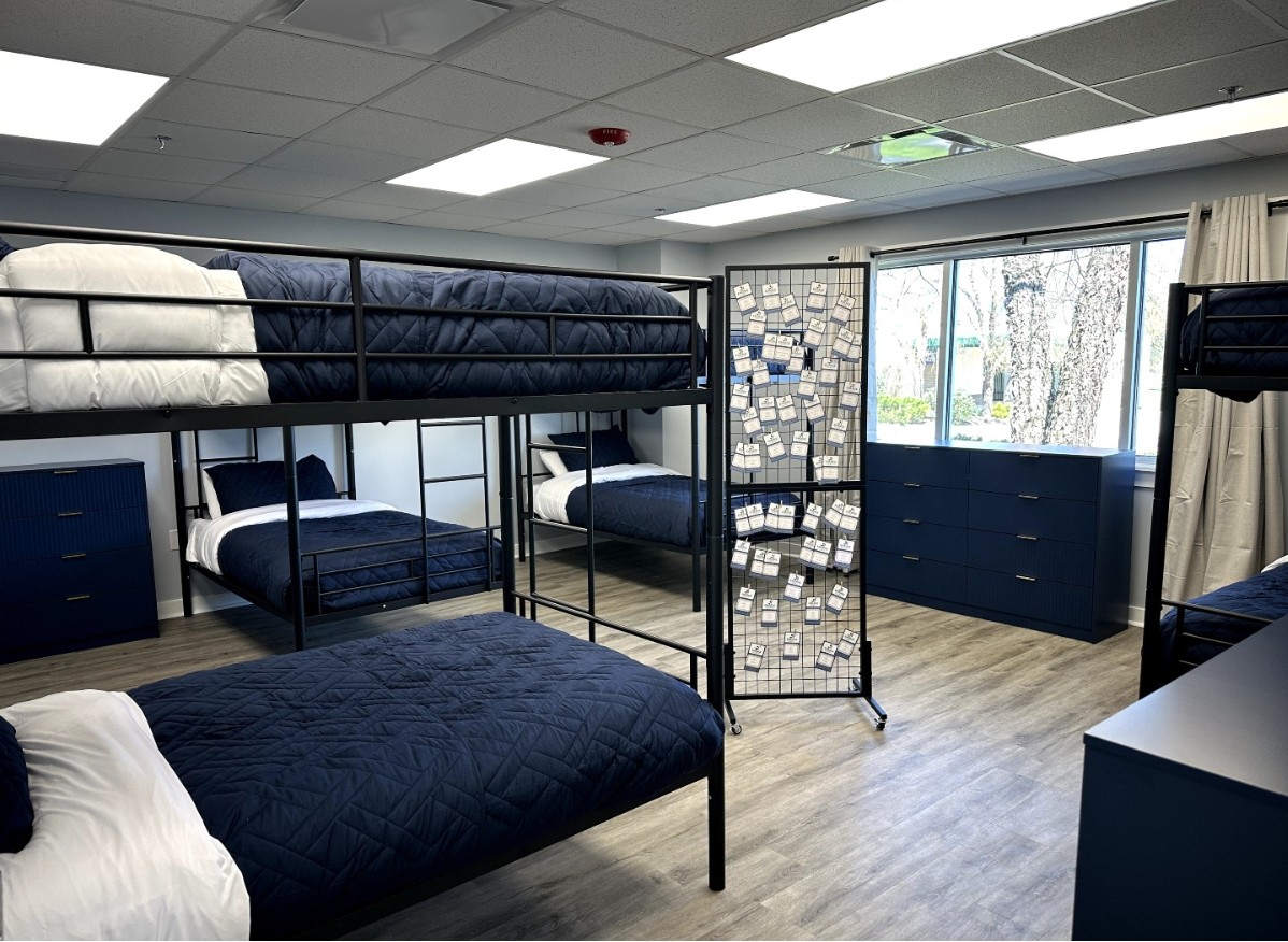 Shared bedroom with multiple beds at Restoration House