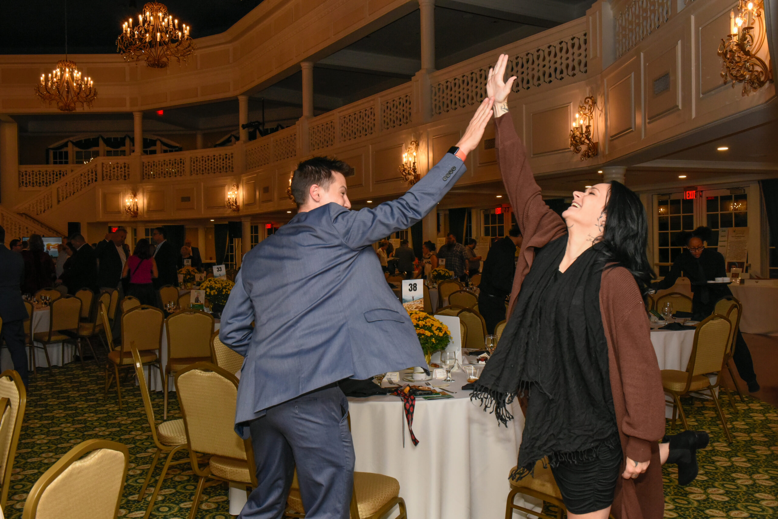 Mic and Tiffanie high five higher